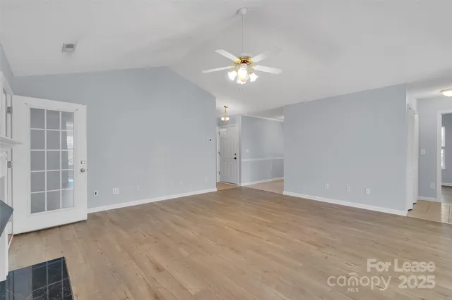 a view of an empty room with a window