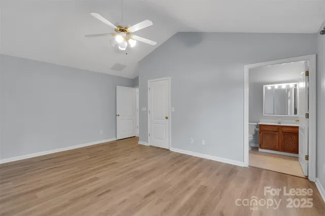 a view of an empty room with a bathroom