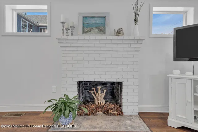 a brick building with a sink and a mirror