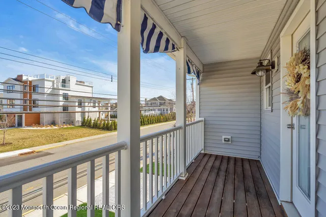 a view of balcony with wooden floor