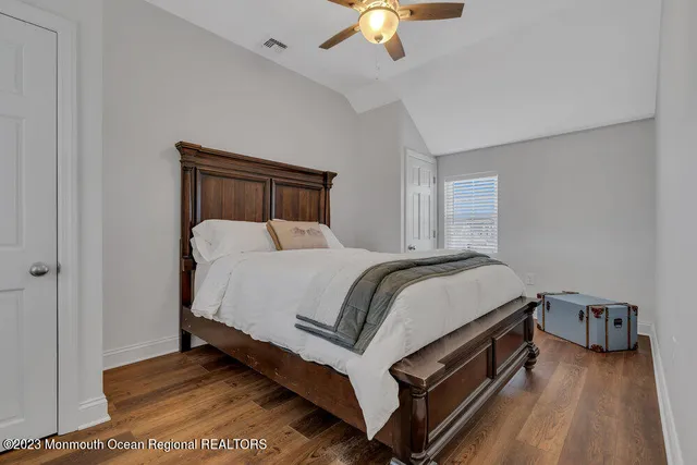 a bed room with a bed and a chandelier