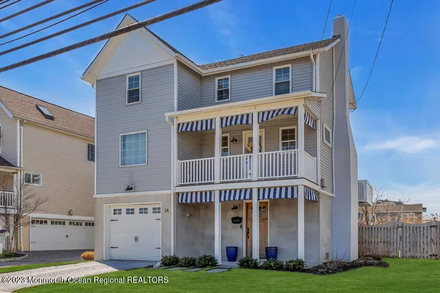 a large building with a small yard and plants