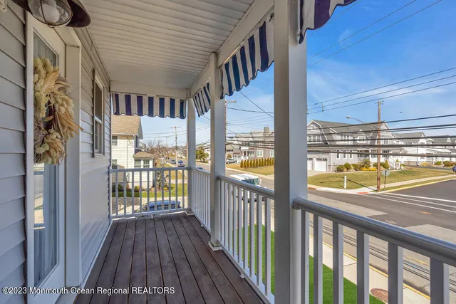 a view of a porch with wooden floor