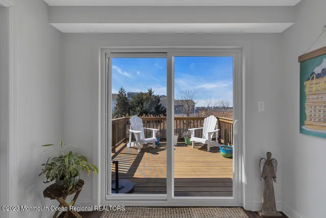 a view of a living room and a balcony