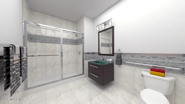 a bathroom with a granite countertop sink a toilet and bathtub