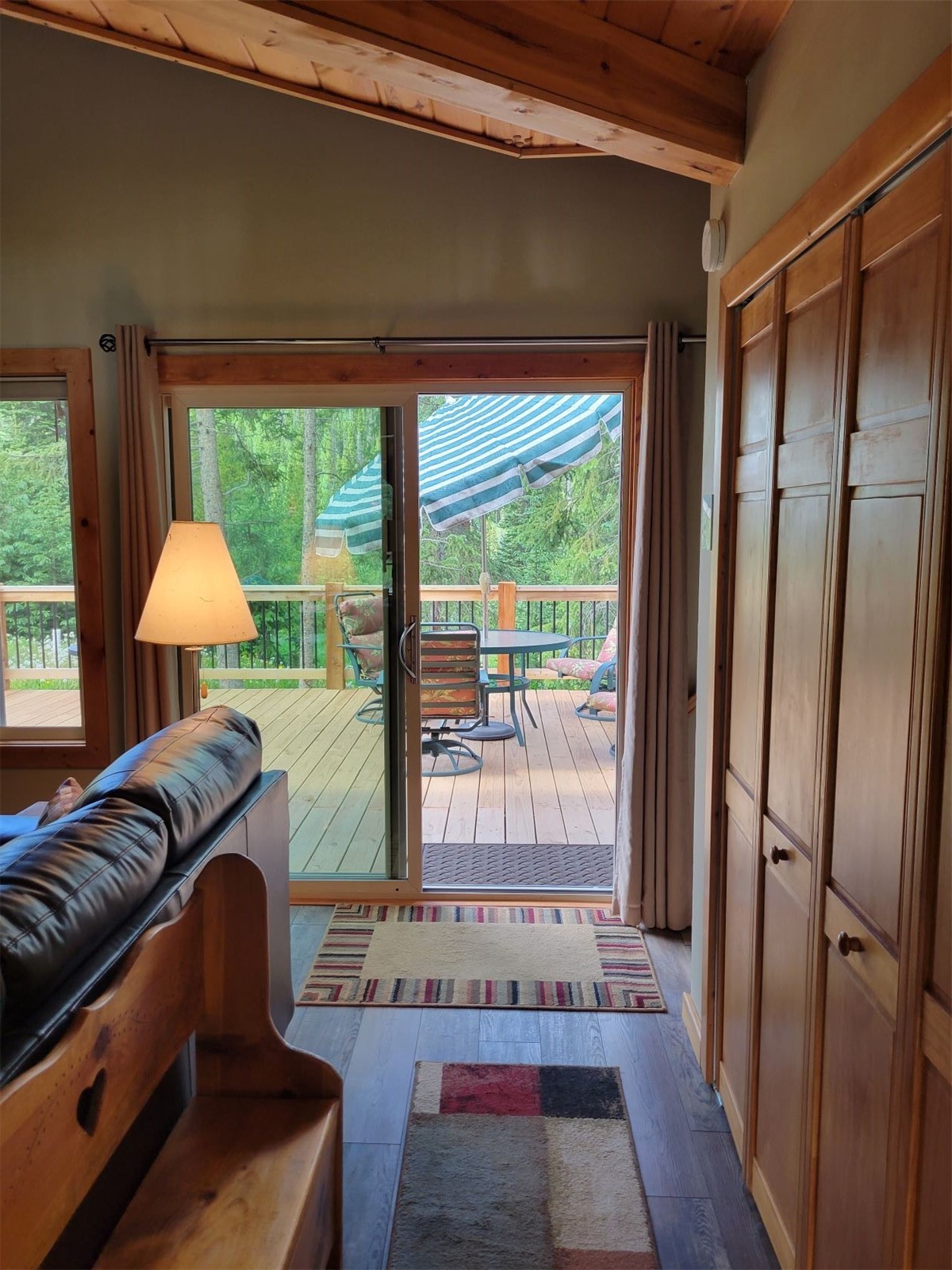 283 Range Road, Unit 4 Breckenridge, CO 80424 - Photo 13 of 32 New High Altitude, Low-E, Wood-Frame expensive custom order sliding glass door to the large deck with a serene setting.