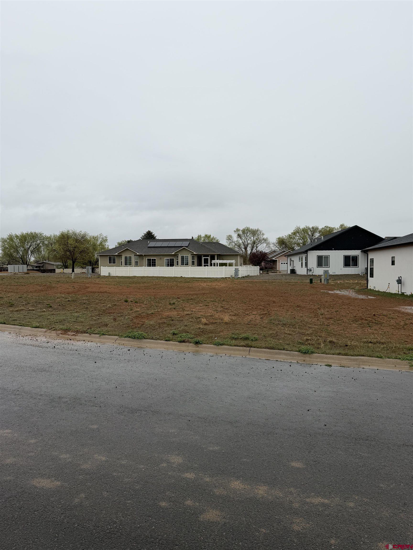 a view of a lake with houses in the back