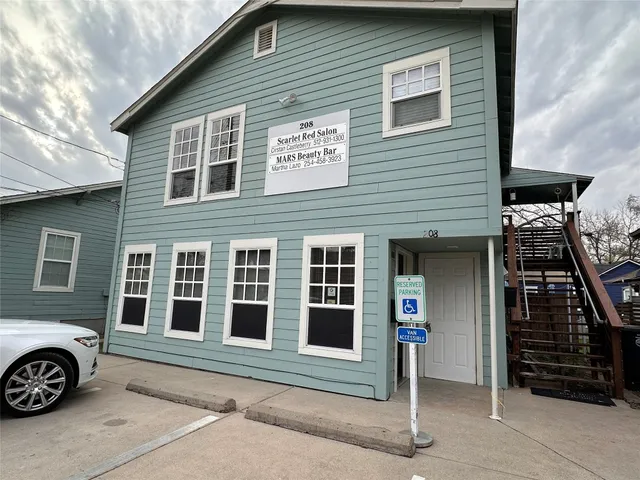 a front view of a house with parking space