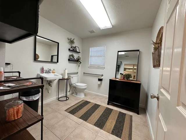 a living room with a couch and a flat screen tv