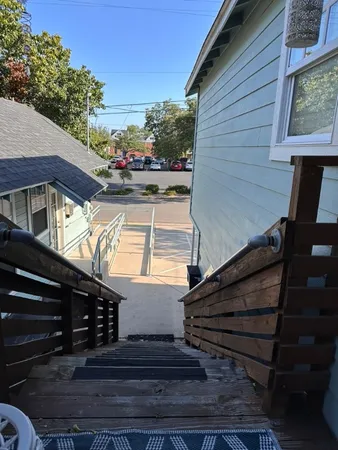 a view of street along with wooden stairs
