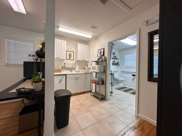 a kitchen with a sink appliances and cabinets