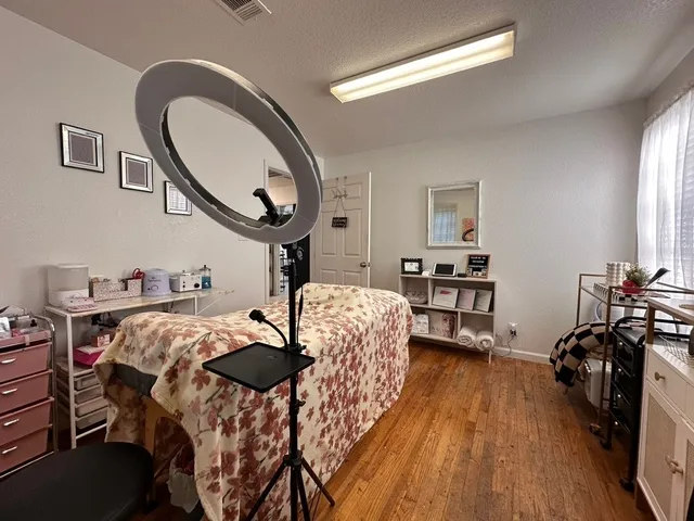 a bed room with furniture and a mirror