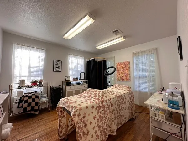 a bedroom with bed and a table