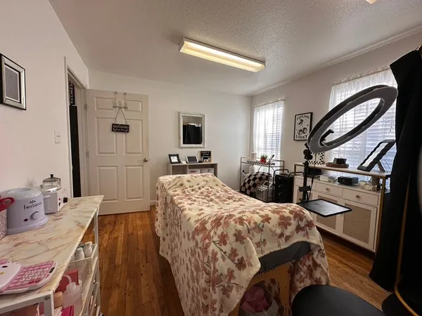 a bed room with a bed and a tv
