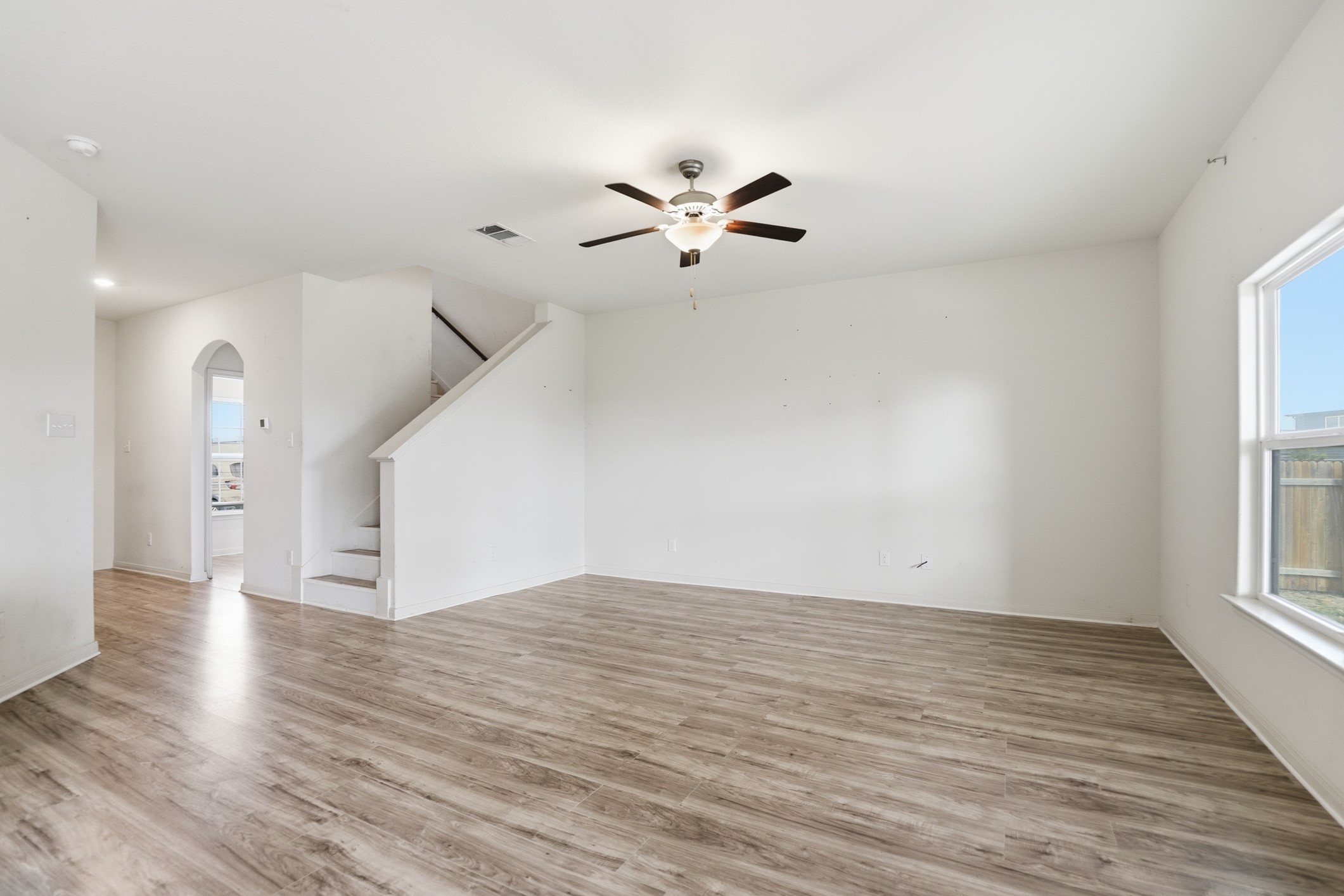 300 Hyacinth Way Jarrell, TX 76537 - Photo 6 of 37 wooden floor in an empty room with a window