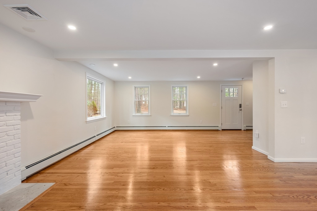 115 Brook Bend Road Hanover, MA 02339 - Photo 13 of 42 a view of an empty room with wooden floor and a window