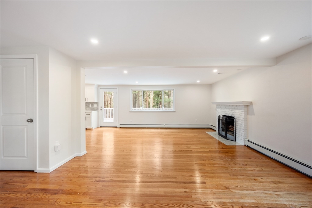 115 Brook Bend Road Hanover, MA 02339 - Photo 15 of 42 a view of an empty room with window and fire place