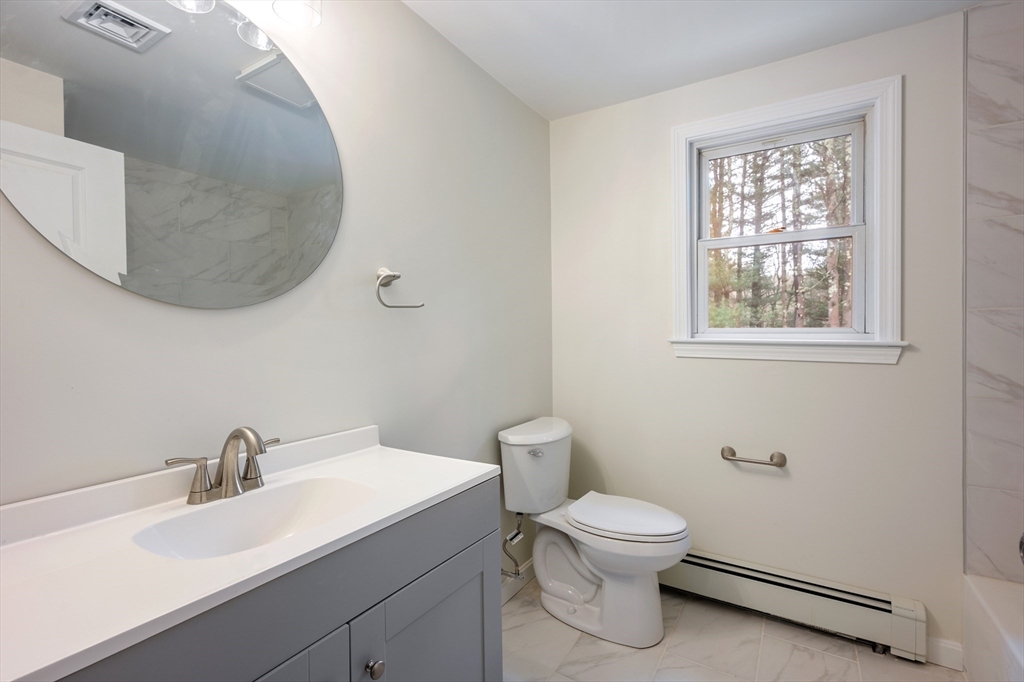 115 Brook Bend Road Hanover, MA 02339 - Photo 26 of 42 a bathroom with a toilet a sink and mirror