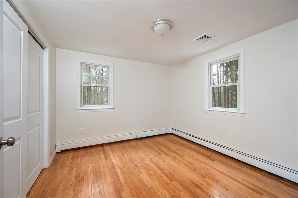 115 Brook Bend Road Hanover, MA 02339 - Photo 30 of 42 wooden floor in an empty room with a window