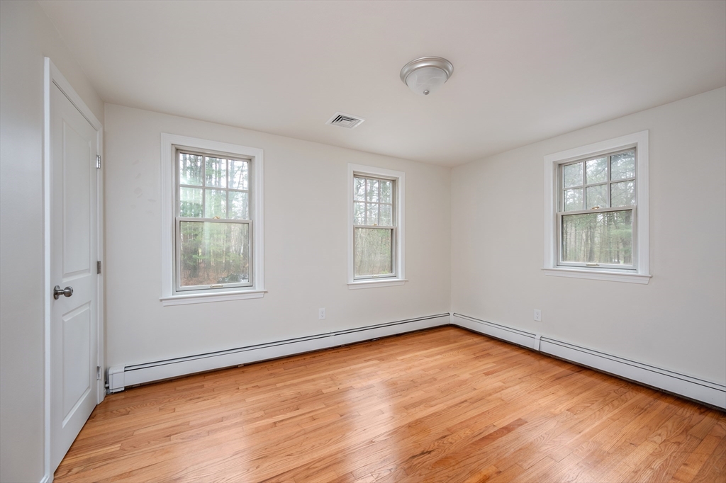 115 Brook Bend Road Hanover, MA 02339 - Photo 31 of 42 wooden floor in an empty room with a window