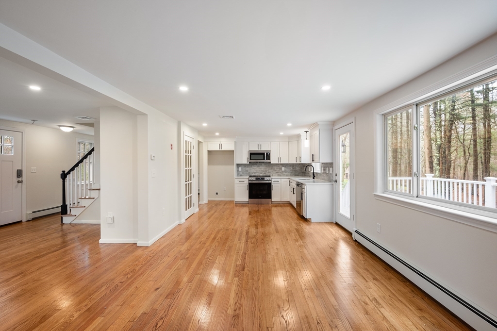 115 Brook Bend Road Hanover, MA 02339 - Photo 6 of 42 a view of a kitchen with wooden floor and electronic appliances