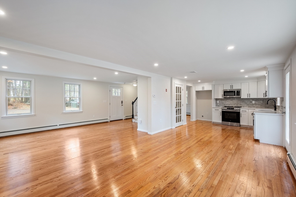 115 Brook Bend Road Hanover, MA 02339 - Photo 9 of 42 a view of a kitchen with a sink and a stove top oven