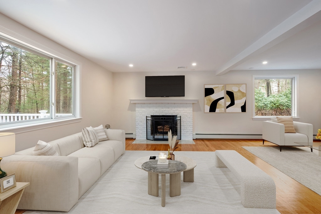 115 Brook Bend Road Hanover, MA 02339 - Photo 10 of 42 a living room with furniture window and a fireplace