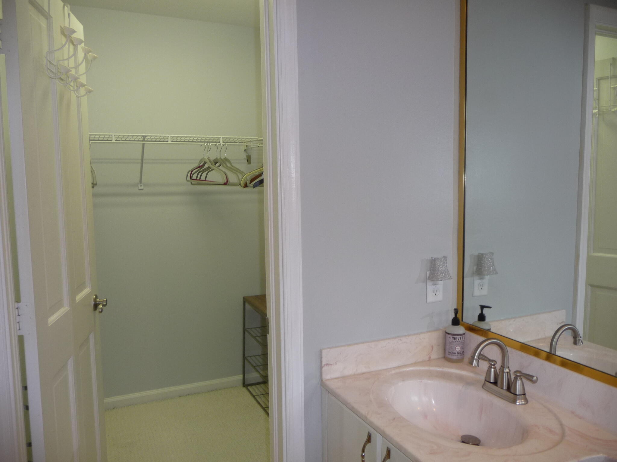 20694 Northwest 27th Avenue Boca Raton, FL 33434 - Photo 17 of 22 a bathroom with a sink and a mirror