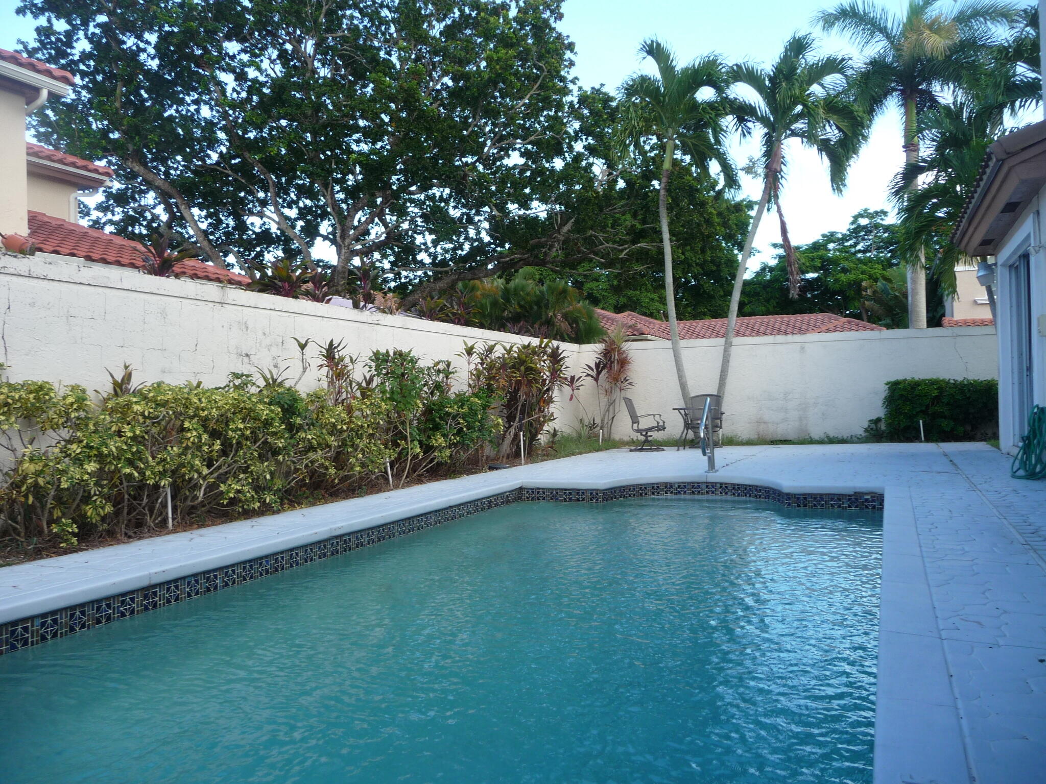20694 Northwest 27th Avenue Boca Raton, FL 33434 - Photo 22 of 22 a view of a swimming pool with a yard
