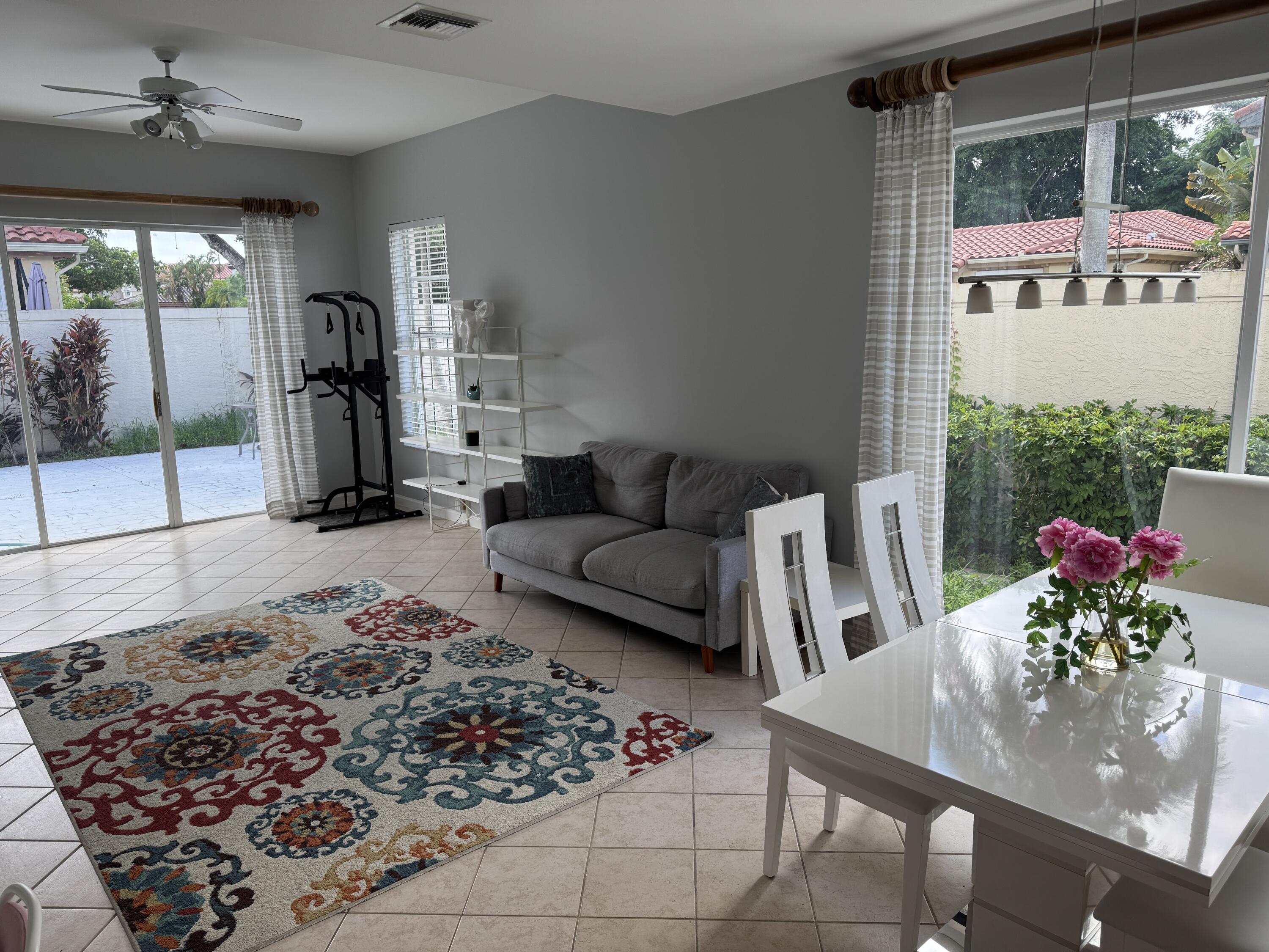 20694 Northwest 27th Avenue Boca Raton, FL 33434 - Photo 6 of 22 a living room with furniture and a potted plant