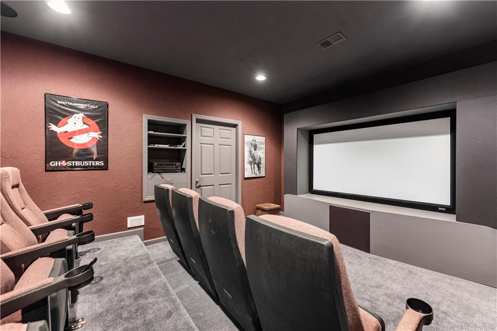 193 Lentz Road Latrobe, PA 15650 - Photo 20 of 45 a media room with lots of chairs and a projector screen