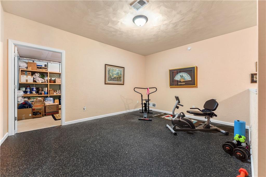 193 Lentz Road Latrobe, PA 15650 - Photo 21 of 45 a view of a room with gym equipment