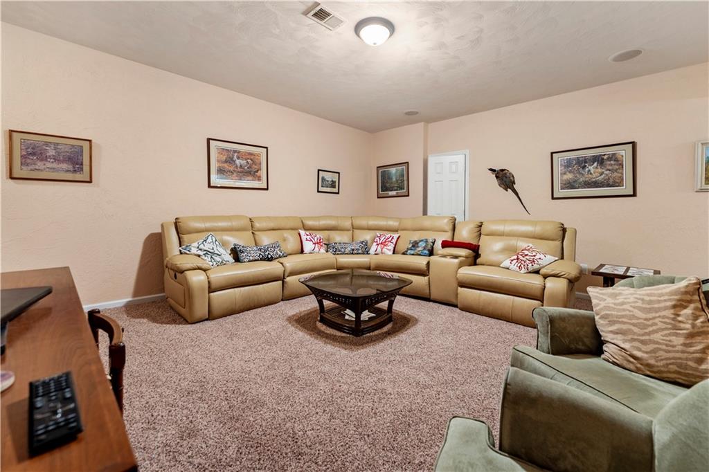 193 Lentz Road Latrobe, PA 15650 - Photo 22 of 45 a living room with furniture a rug and a couch