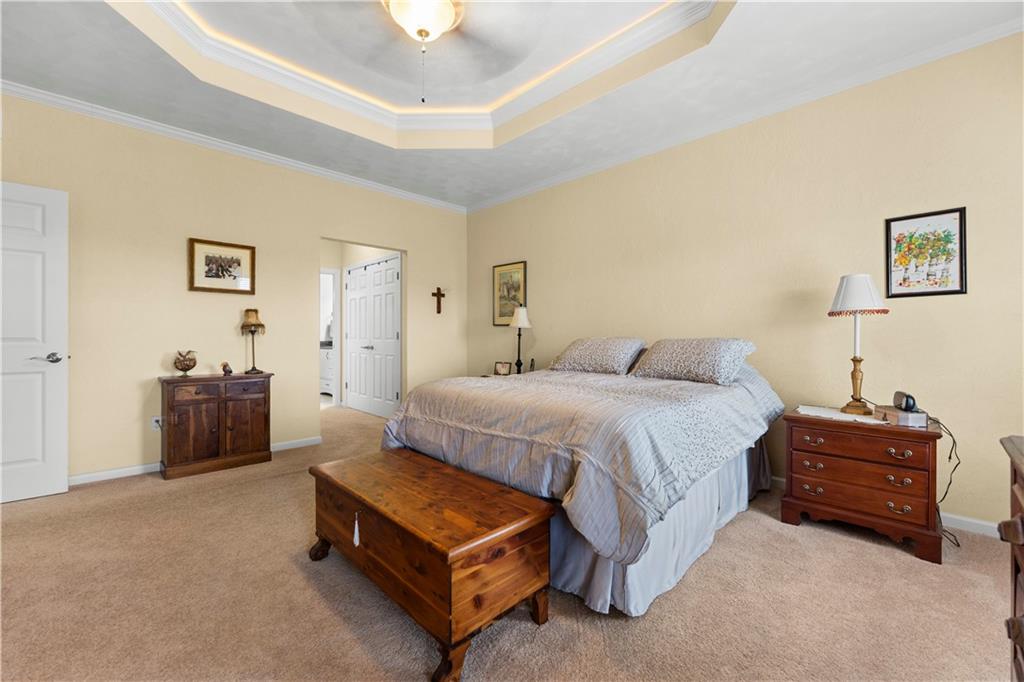 193 Lentz Road Latrobe, PA 15650 - Photo 27 of 45 a spacious bedroom with a bed and a couch