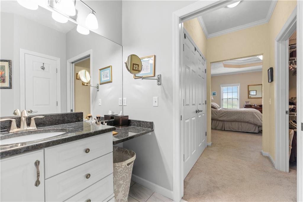 193 Lentz Road Latrobe, PA 15650 - Photo 29 of 45 a en suite bathroom with a sink and a mirror