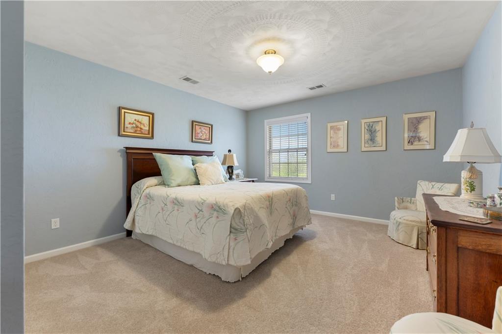 193 Lentz Road Latrobe, PA 15650 - Photo 33 of 45 a bedroom with a bed and a desk