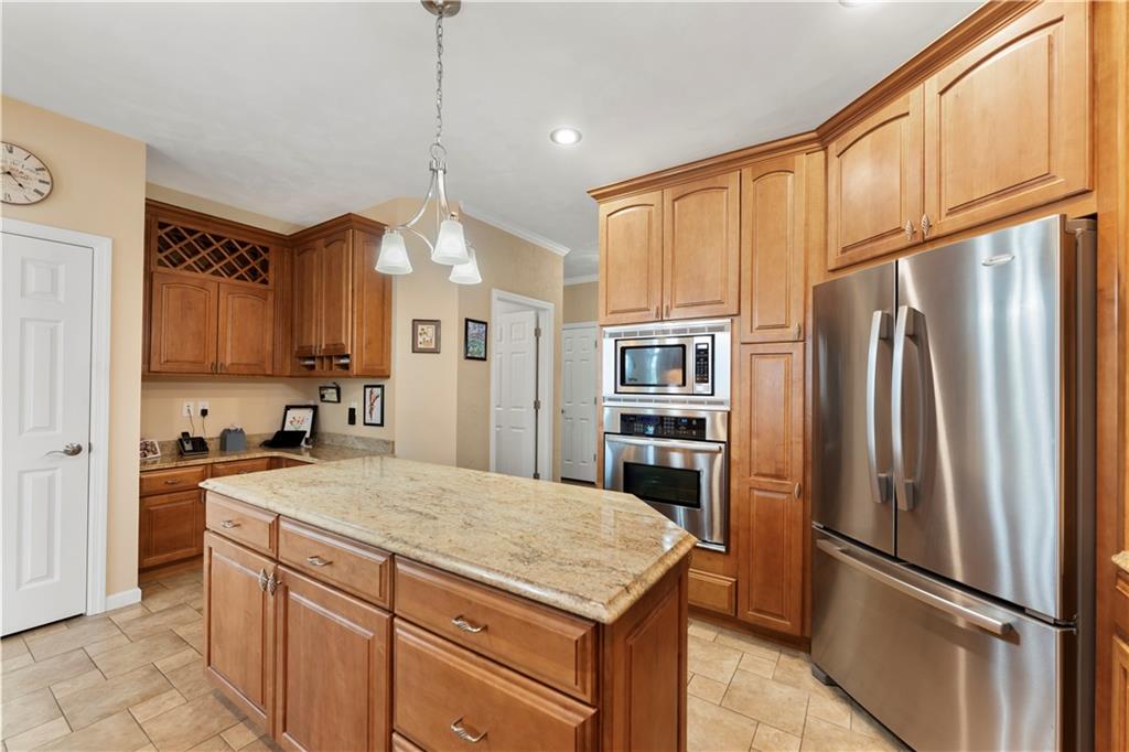 193 Lentz Road Latrobe, PA 15650 - Photo 9 of 45 a kitchen with a refrigerator a sink and cabinets