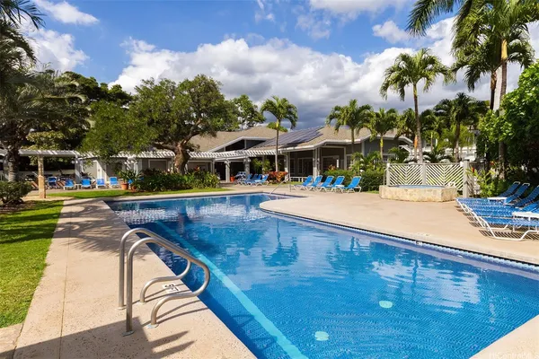 a view of living room kitchen with furniture and wooden floor