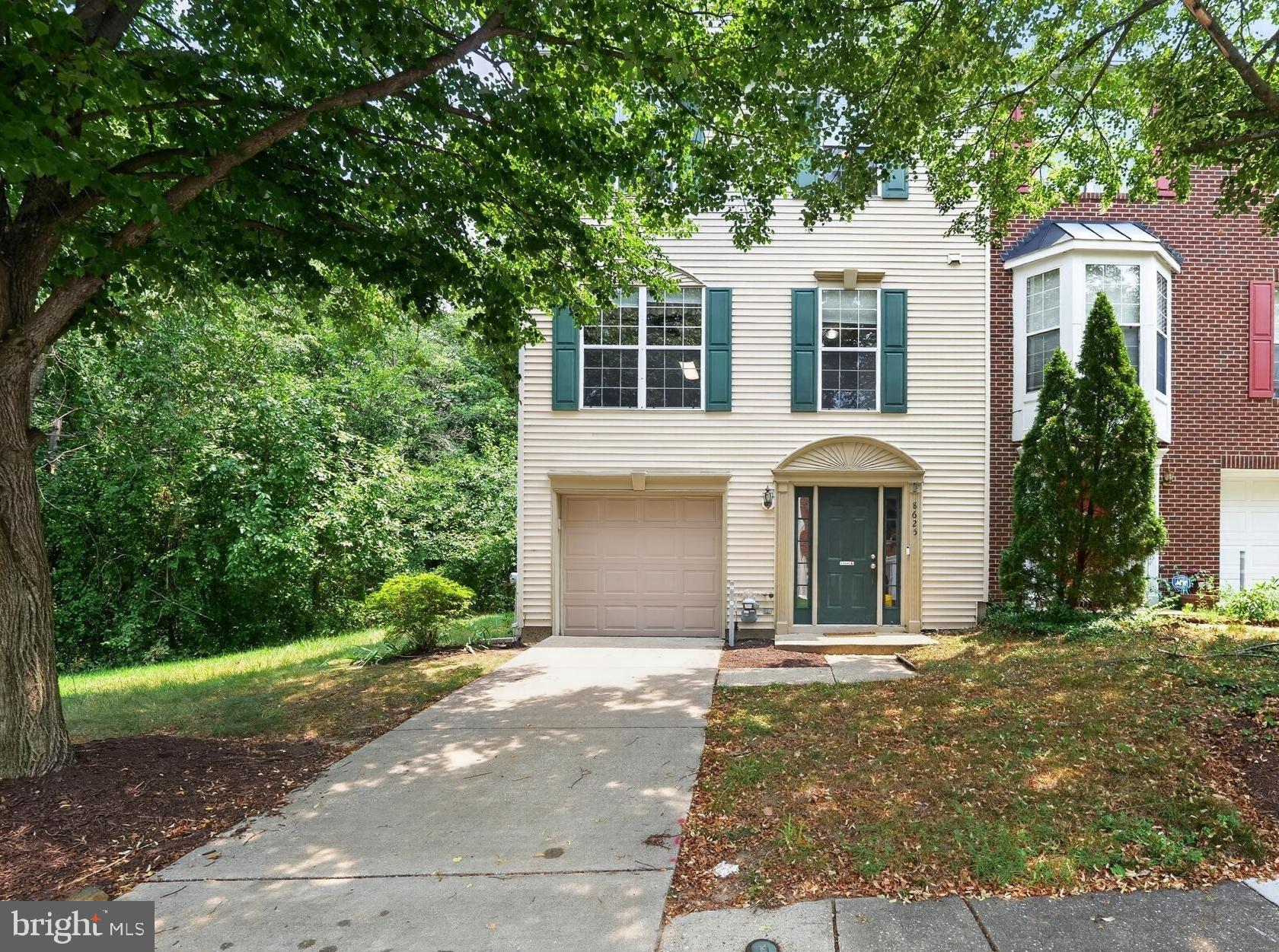 8625 Indian Springs Road Laurel, MD 20724 - Photo 1 of 16 Charming home with lush greenery backdrop.