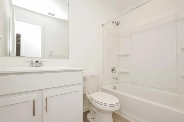 a bathroom with a sink a toilet and a bathtub