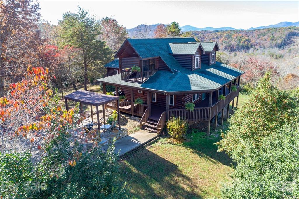 976 Freemantown Road Rutherfordton, NC 28139 - Photo 1 of 23 an aerial view of a house with yard outdoor seating and mountain view