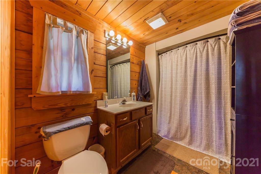 976 Freemantown Road Rutherfordton, NC 28139 - Photo 11 of 23 a bathroom with a toilet a sink and a shower