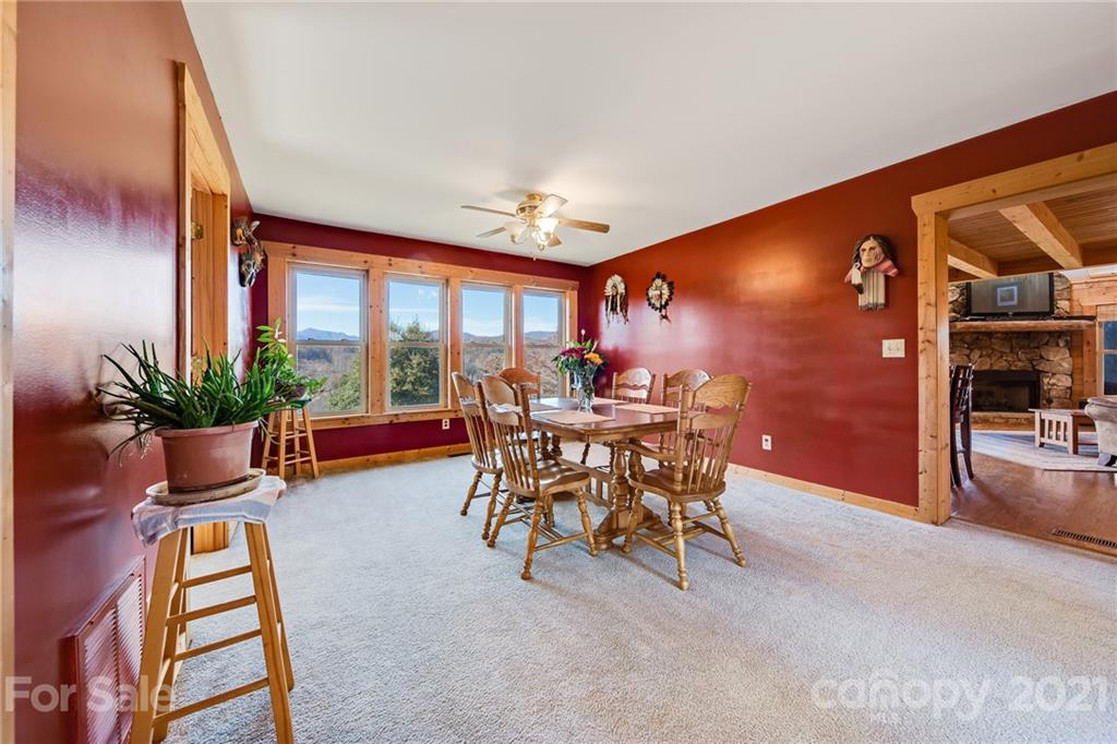 976 Freemantown Road Rutherfordton, NC 28139 - Photo 12 of 23 a dining room with furniture and a floor to ceiling window