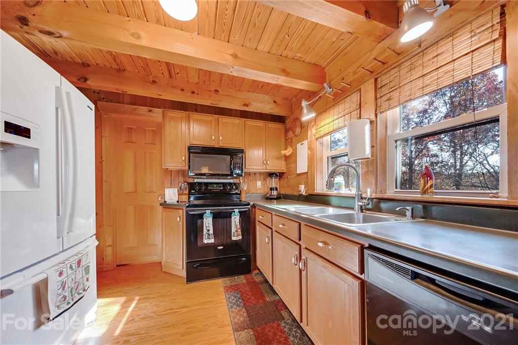 976 Freemantown Road Rutherfordton, NC 28139 - Photo 7 of 23 a kitchen with stainless steel appliances a sink and a stove