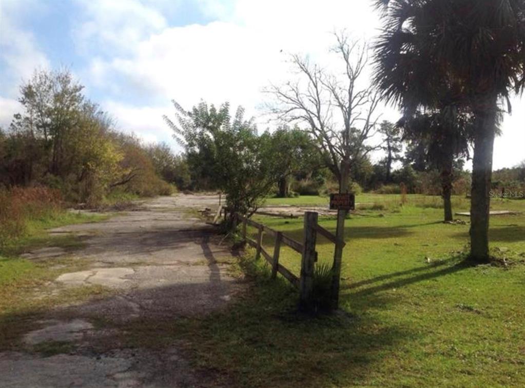 799 9th Street Orlando, FL 32820 - Photo 2 of 5 a view of a park with bench and trees