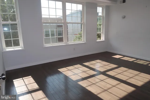 a view of livingroom with hardwood floor and a ceiling fan
