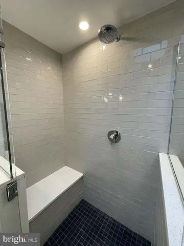 a kitchen with granite countertop stainless steel appliances a sink cabinets and a stove top oven