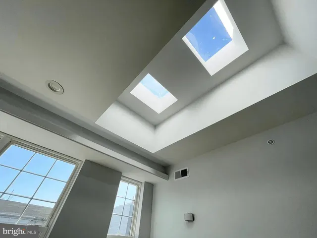 a view of a hallway with washer and dryer