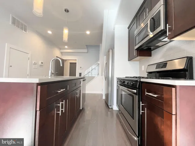 a bathroom with a double vanity sink mirror double and shower