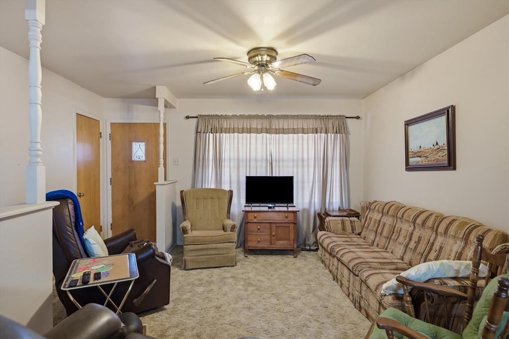 1910 Goodnight Boulevard Wills Point, TX 75169 - Photo 15 of 37 a living room with furniture and a flat screen tv